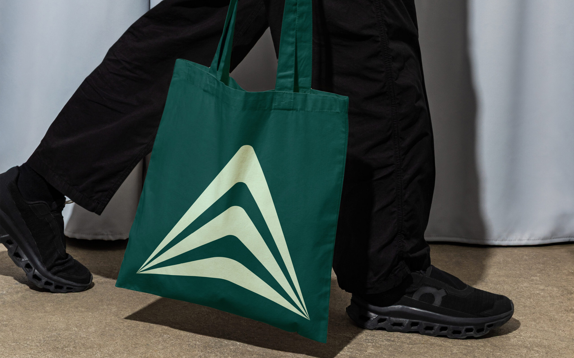 light green icon on dark blue canvas bag