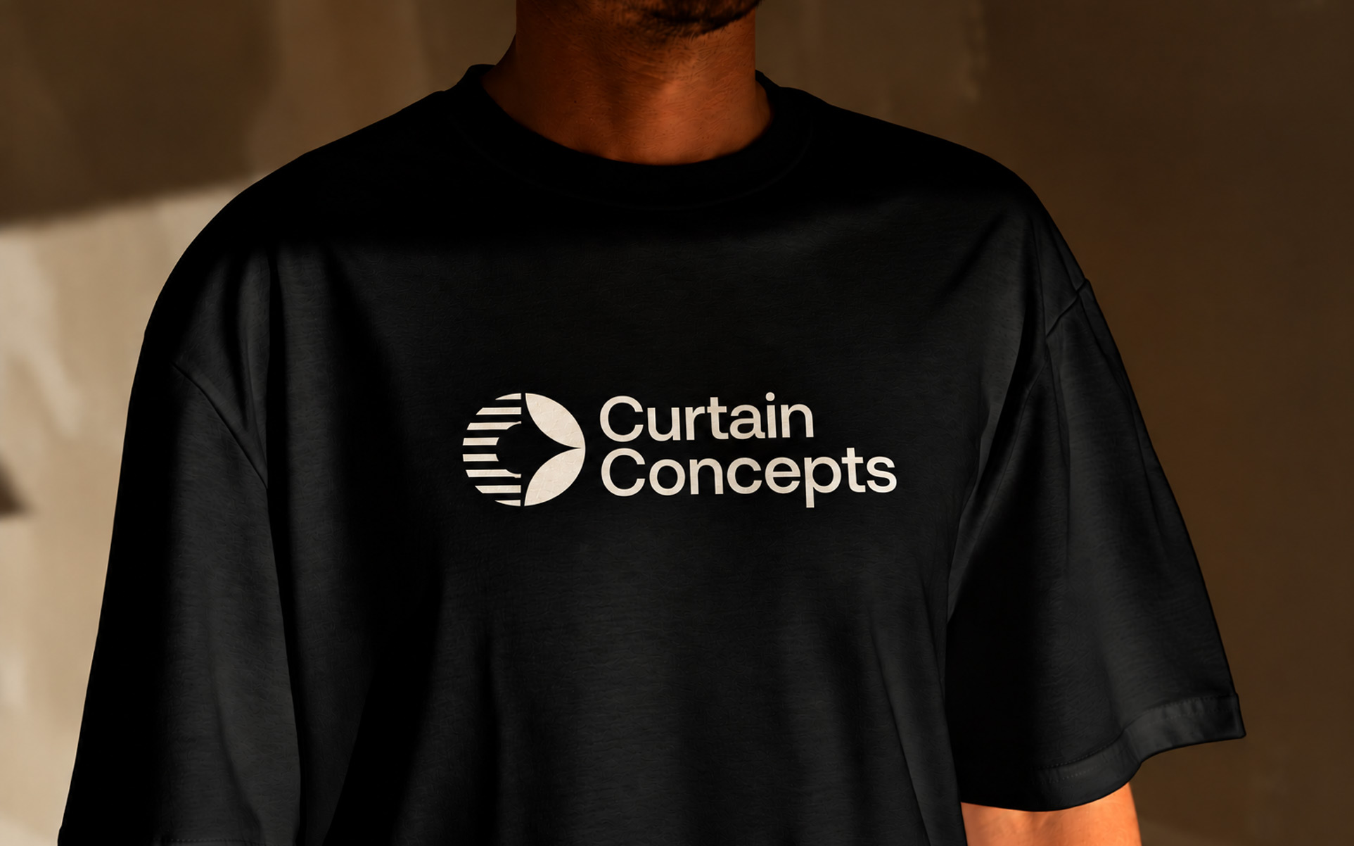 white logo with icon on a black t-shirt